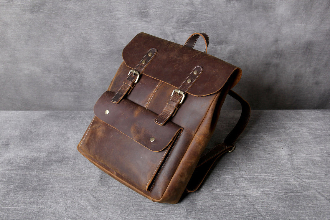 handcrafted vintage real leather carry on backpack with gold-tone brass hardware and adjustable strap