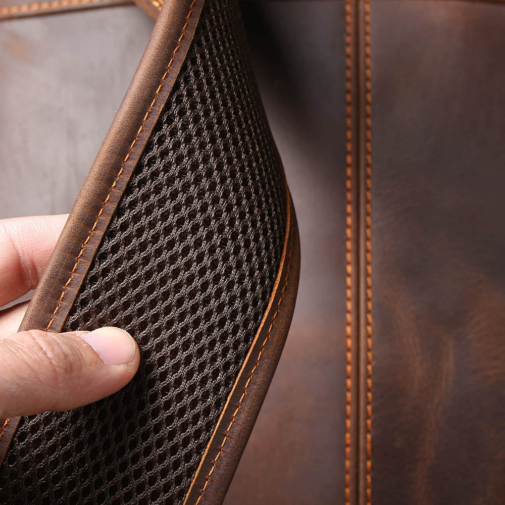 underside of the padded shoulder strap, lined with honeycomb mesh