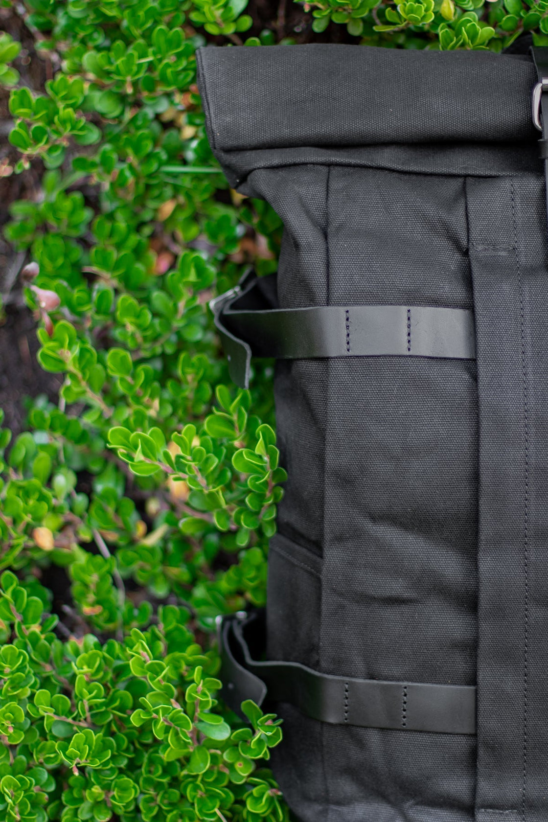 Black Gstaad biker canvas satchel with anti-theft pocket and rolltop closure for secure everyday carry