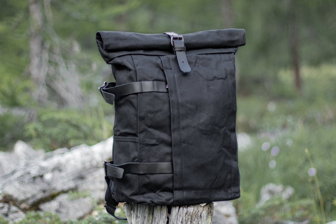 Black Gstaad sturdy biker canvas backpack with rolltop closure and reinforced leather strap