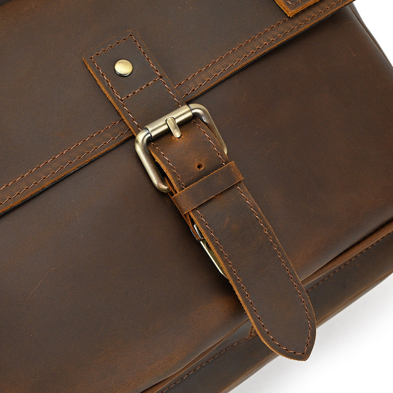 rolltop laptop hiking backpack with gold-tone brass hardware and metallic buckle
