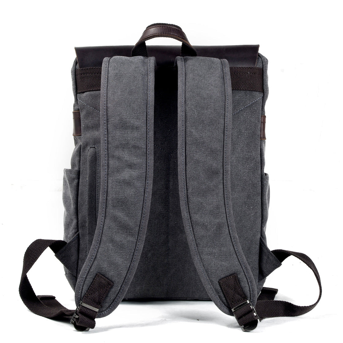 Back panel of the dark grey Milan cotton canvas backpack showing padded canvas shoulder straps, top grab handle and reinforced stitching
