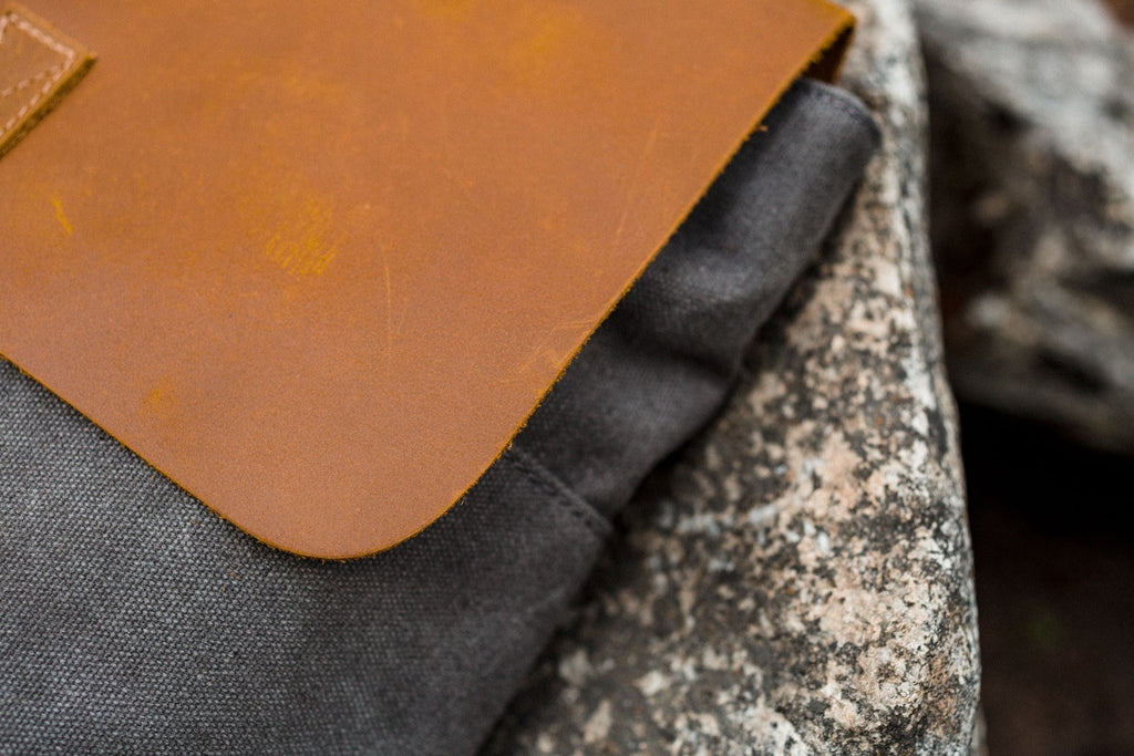 Detail of the cotton canvas weave and reinforced stitching on the Nora women's canvas backpack