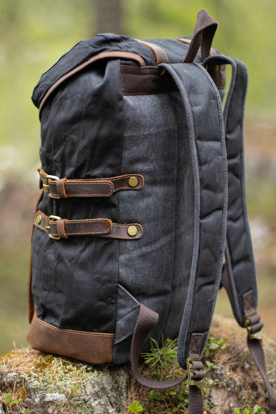 Black Rostock leather and canvas bookbag styling for men and women with full-grain leather flap and brass buckles