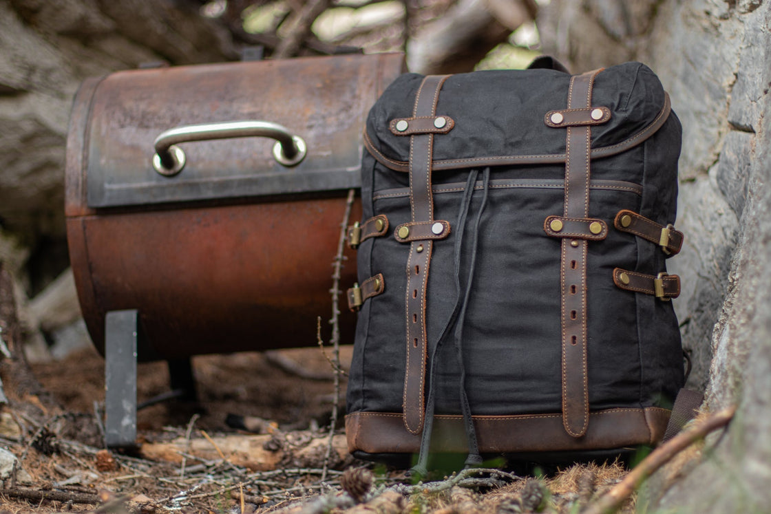 Black Rostock vintage bookbag with capacity for clutches, camping gear and everyday essentials