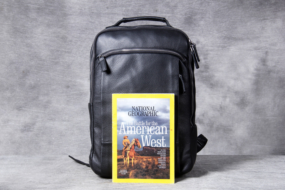 back of the black leather backpack: padded straps and the luggage pass-through band