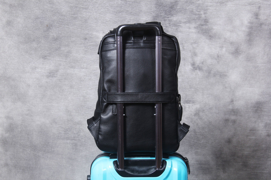 front pocket zip of the leather laptop backpack, leather pull and gunmetal slider