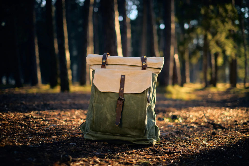 Open interior of the Yukon vintage canvas backpack revealing the dark polyester lining and laptop compartment