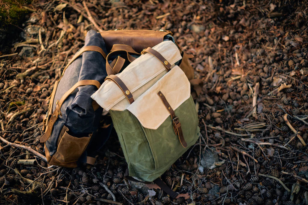 Macro of the leather flap with antiqued brass buckle on the Yukon vintage canvas backpack