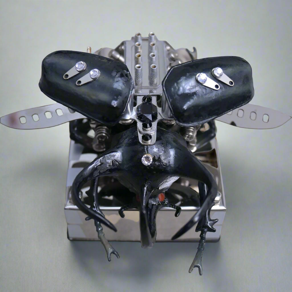 Metallic insect-like creature with black wings and legs on a reflective surface
Diyion mechanical model kit DIY assembly engineering educational toy