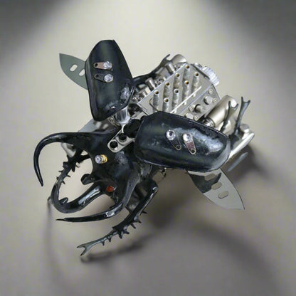 Metallic beetle toy with black and silver details on a white background, Diyion mechanical model kit DIY assembly engineering educational toy