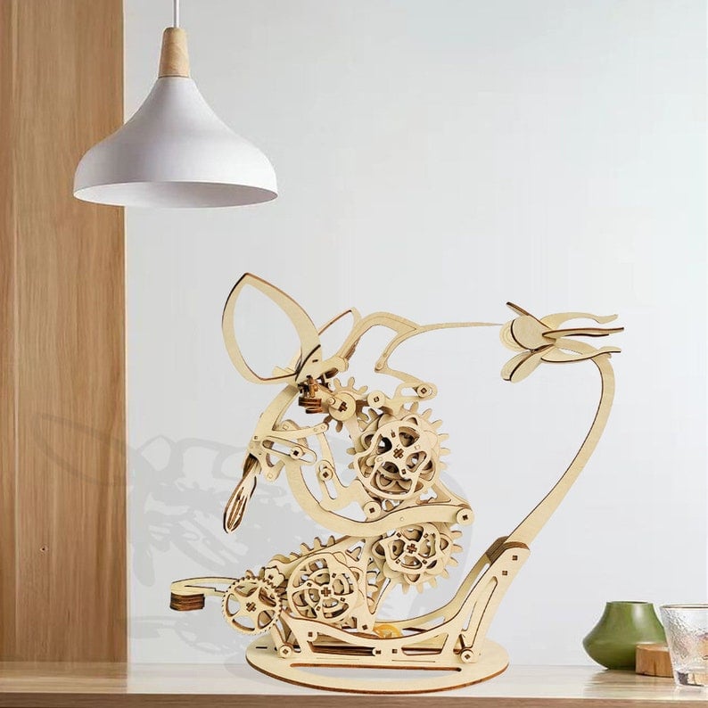 Wooden mechanical model of a dog with gears on a table Diyion | Kinetic Hummingbird Sculpture - 3D Wooden Mechanical Puzzle Kit