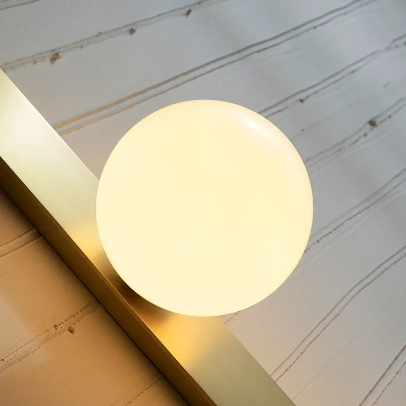 GildedLume – Wall Light with Golden Glass Sphere