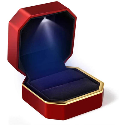 Red and gold jewelry box with a blue interior LED ring box with automatic light for engagement proposals and wedding jewelry display