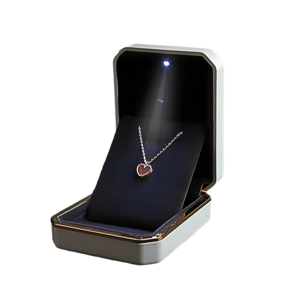 Jewelry box with a heart-shaped pendant inside LED ring box with automatic light for engagement proposals and wedding jewelry display