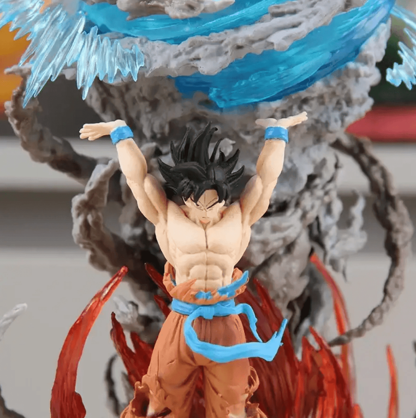 Hand-painted Diyion Son Goku collectible in a dynamic Spirit Bomb pose for anime display shelves
