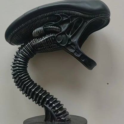 Black alien head with a long neck on a white background -Unique alien creature resin lamp stand for modern home decor