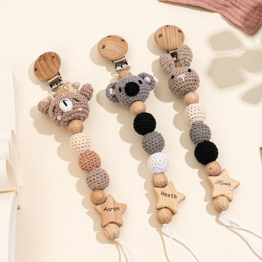 Set of personalized crochet animal pacifier holders with custom names, newborn nursery and baby shower gifts