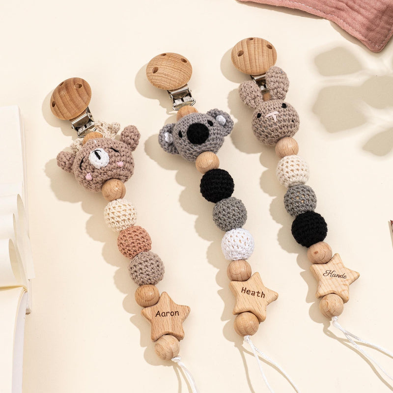Set of personalized crochet animal pacifier holders with custom names, newborn nursery and baby shower gifts