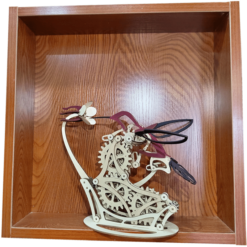 Mechanical dragon model with gears on a wooden shelf Diyion | Kinetic Hummingbird Sculpture - 3D Wooden Mechanical Puzzle Kit