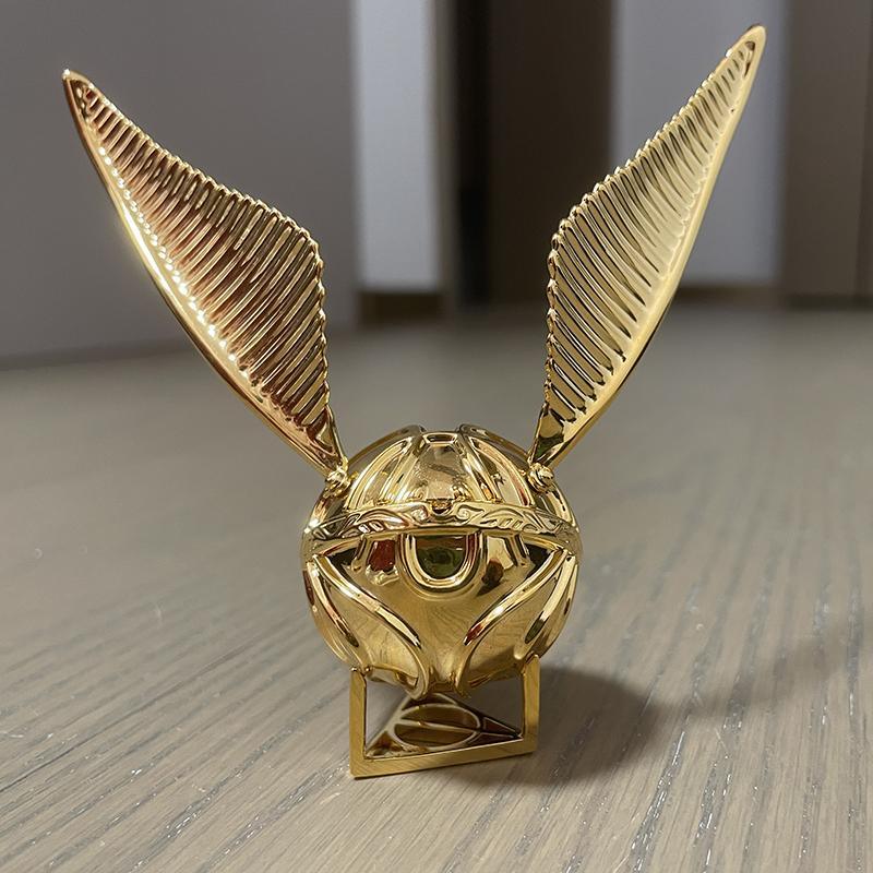 Diyion Golden Snitch ring box with wand-shaped key and engraved I Open at the Close phrase