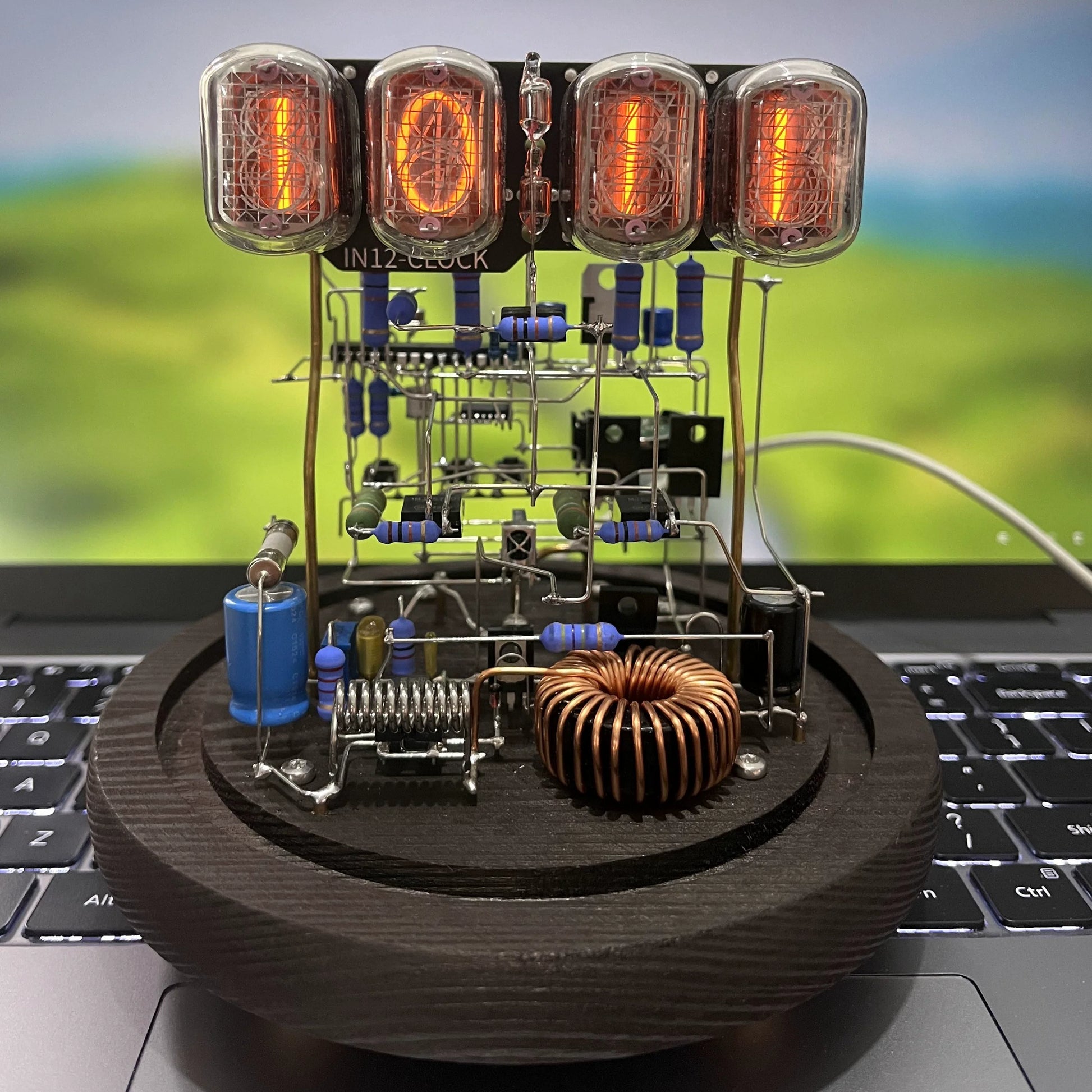 Vintage nixie tube clock with glowing amber display and wooden base from Diyion