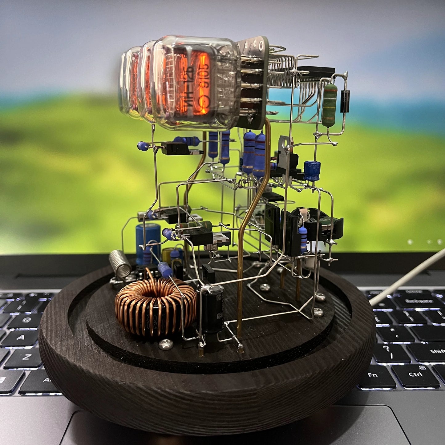 Vintage nixie tube clock with glowing amber display and wooden base from Diyion