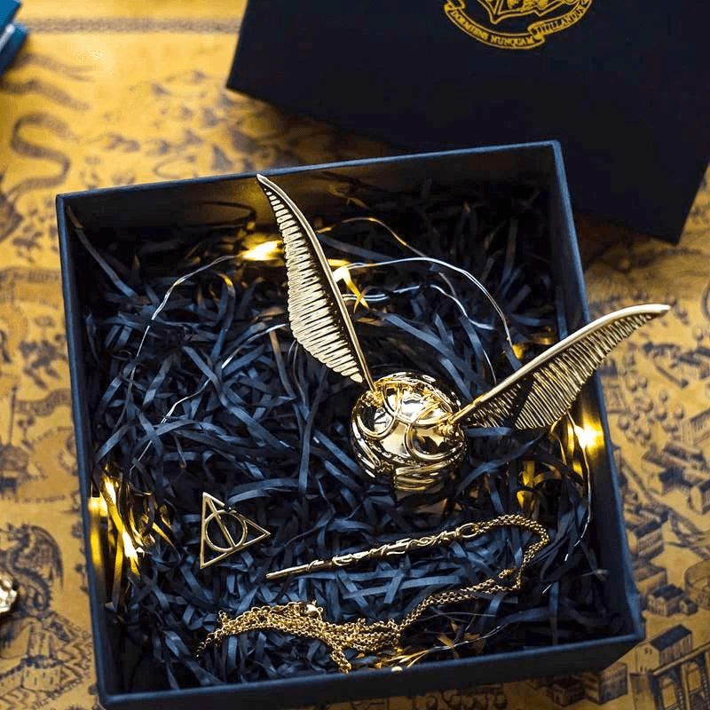 Diyion Golden Snitch ring box opened to show the removable velvet insert for presenting a ring