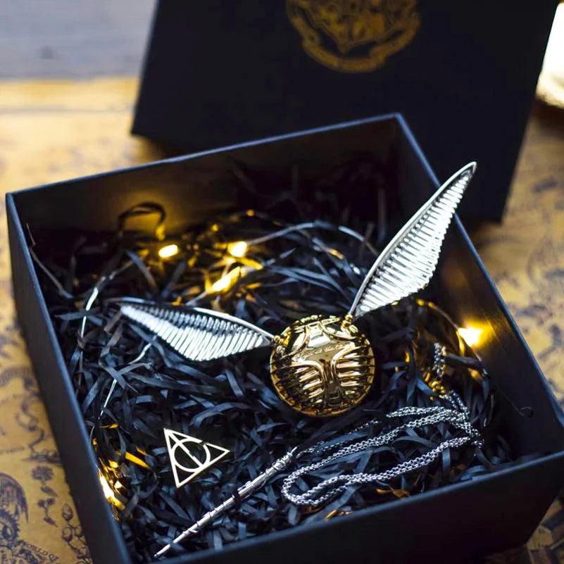 Diyion Harry Potter Golden Snitch ring box displayed on the included Deathly Hallows stand