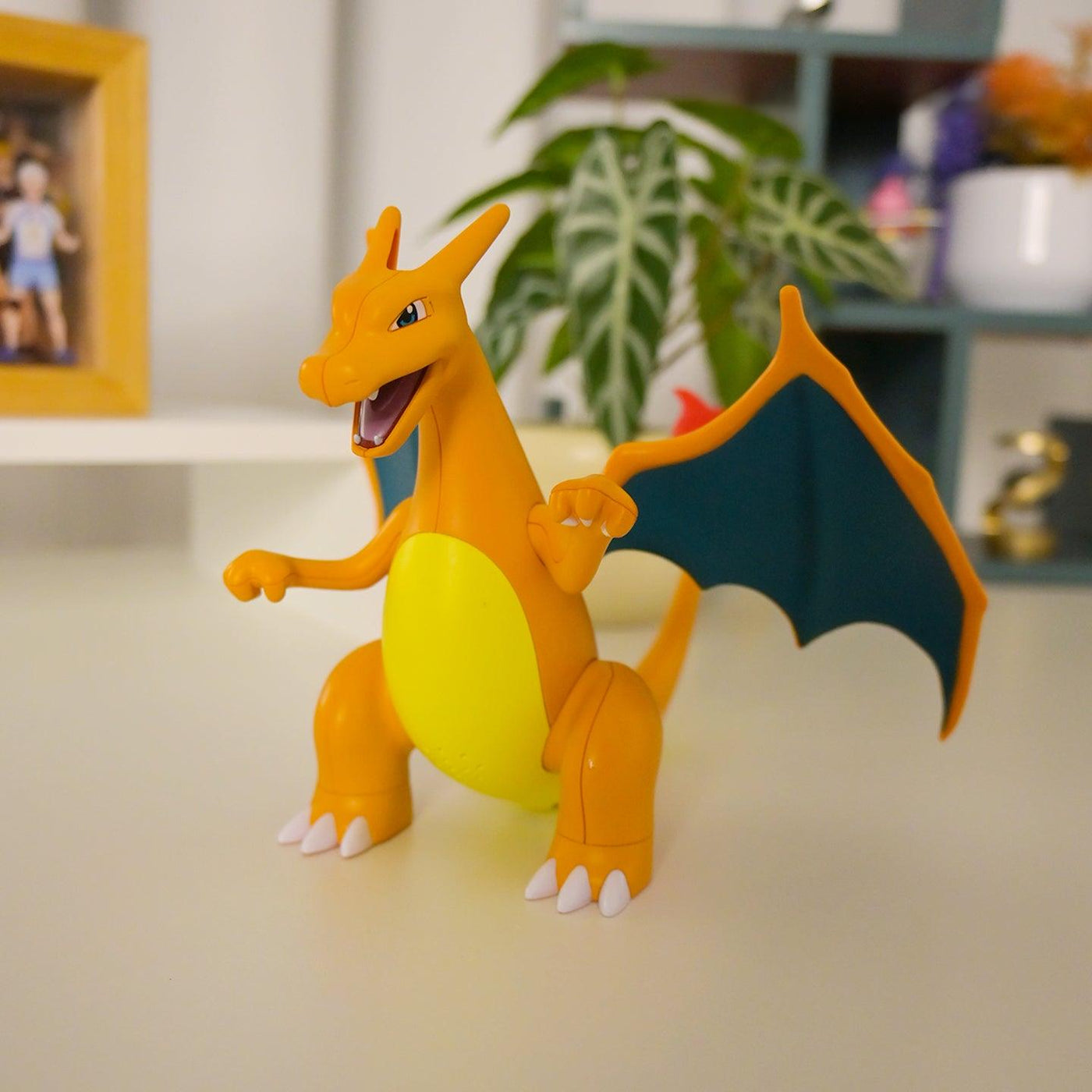 Charizard figure displayed indoors as a Pokémon collectible for kids ages 6 and older